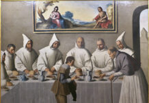 La obra de Zurbarán llegá a la National Gallery de Londres con histórica exposición Pintura barroca de Francisco de Zurbarán que muestra a san Hugo compartiendo mesa con monjes cartujos vestidos de blanco en el refectorio de un monasterio. Un joven sirviente atiende la mesa mientras una pintura religiosa preside la escena desde la pared superior.