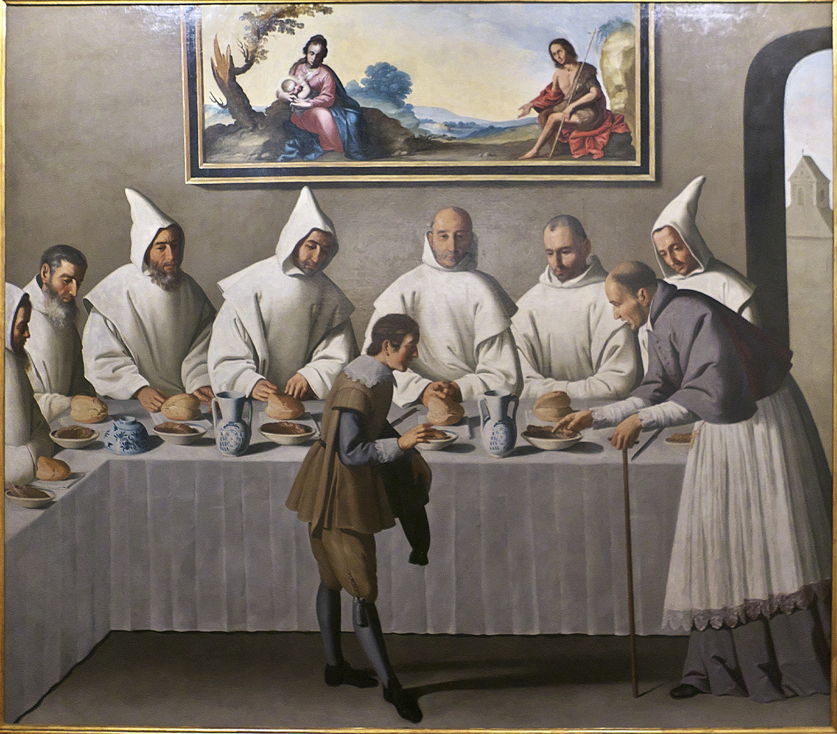 Pintura barroca de Francisco de Zurbarán que muestra a san Hugo compartiendo mesa con monjes cartujos vestidos de blanco en el refectorio de un monasterio. Un joven sirviente atiende la mesa mientras una pintura religiosa preside la escena desde la pared superior.