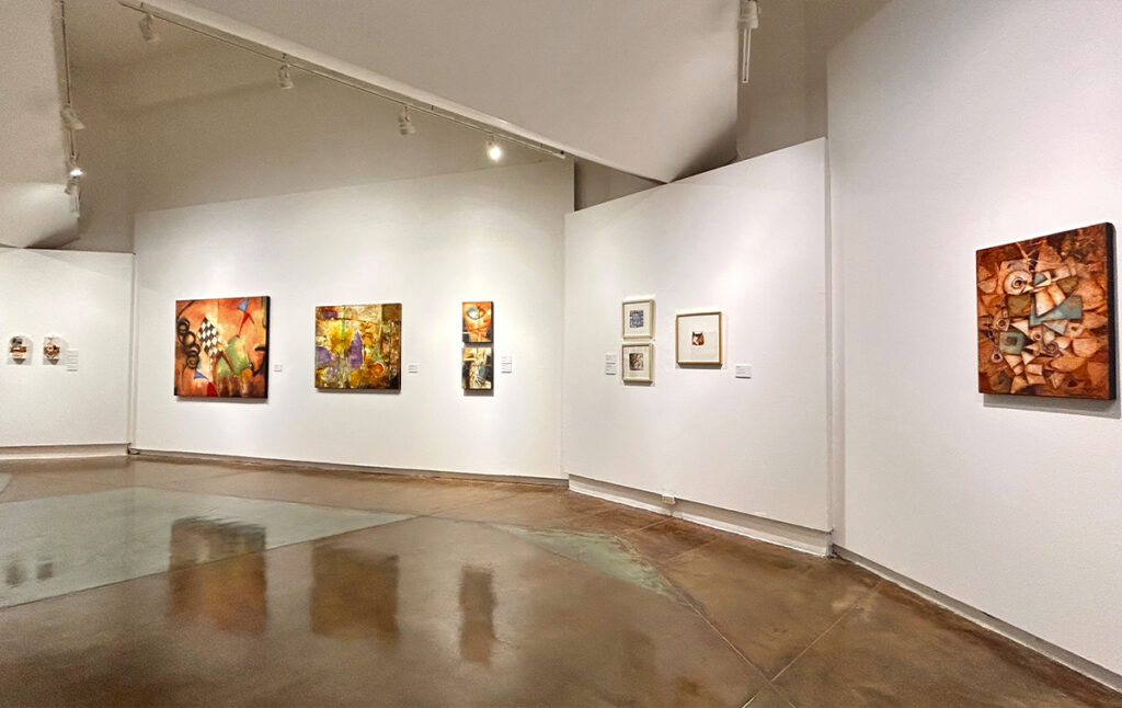 A gallery at the Tamaulipas Museum of Contemporary Art featuring a variety of artworks on display.