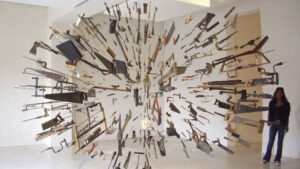 An installation by Damián Ortega consisting of saws, hammers, shovels, axes, and other tools suspended in the shape of an explosion.